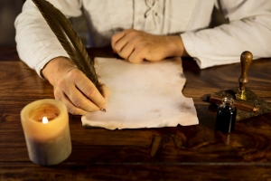 Man Writing On A Parchment